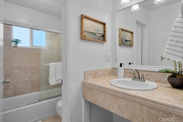 1006 Palm Ln, Redondo Beach, CA 90278 - full bathroom featuring toilet, combined bath / shower with glass door, vanity, and tile patterned floors