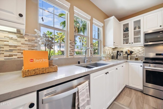 865 Orchid Way Unit A, Azusa, CA 91702 - kitchen featuring stainless steel appliances, a sink, light countertops, and tasteful backsplash