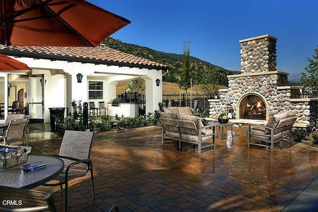 865 Orchid Way Unit A, Azusa, CA 91702 - view of patio / terrace with a mountain view and an outdoor living space with a fireplace