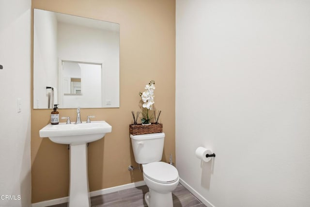 865 Orchid Way Unit A, Azusa, CA 91702 - bathroom with toilet, wood finished floors, and baseboards