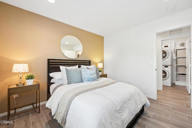 865 Orchid Way Unit A, Azusa, CA 91702 - bedroom featuring estacked washer and dryer, wood finished floors, baseboards, and recessed lighting