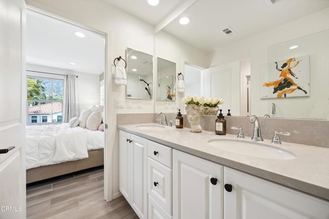 865 Orchid Way Unit A, Azusa, CA 91702 - bathroom with double vanity, recessed lighting, wood finished floors, and ensuite bathroom