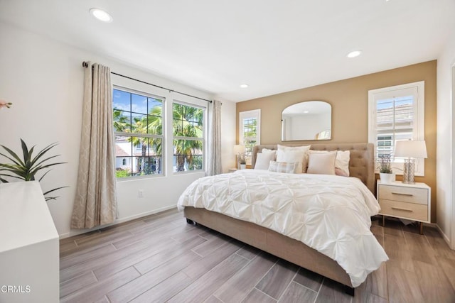865 Orchid Way Unit A, Azusa, CA 91702 - bedroom with multiple windows, wood finished floors, baseboards, and recessed lighting