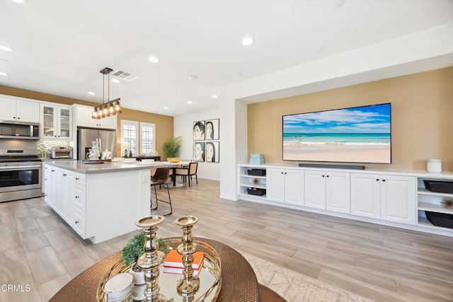 865 Orchid Way Unit A, Azusa, CA 91702 - living room featuring recessed lighting and light wood-type flooring