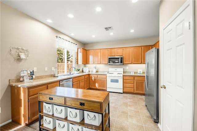 29288 Woodlea Ln, Menifee, CA 92584 - kitchen featuring appliances with stainless steel finishes, light countertops, recessed lighting, a sink, and light tile patterned flooring