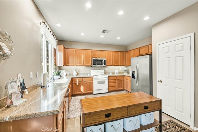 29288 Woodlea Ln, Menifee, CA 92584 - kitchen with stainless steel appliances, recessed lighting, light tile patterned floors, and a sink