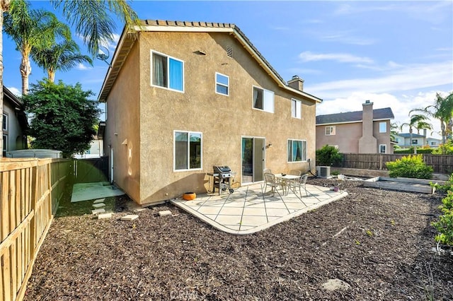 29288 Woodlea Ln, Menifee, CA 92584 - back of property with stucco siding, central air condition unit, a fenced backyard, and a patio area