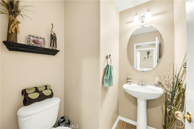29288 Woodlea Ln, Menifee, CA 92584 - half bathroom with toilet, a sink, and tile patterned flooring