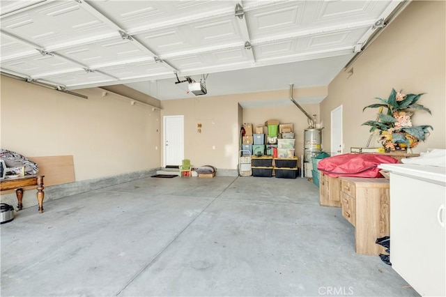 29288 Woodlea Ln, Menifee, CA 92584 - garage featuring a garage door opener and water heater