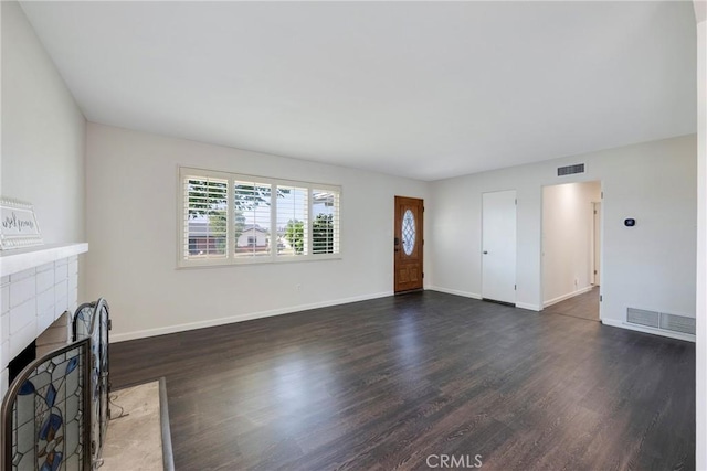 228 W Old Ml, Corona, CA 92882 - unfurnished living room with a fireplace with flush hearth and dark wood-style flooring