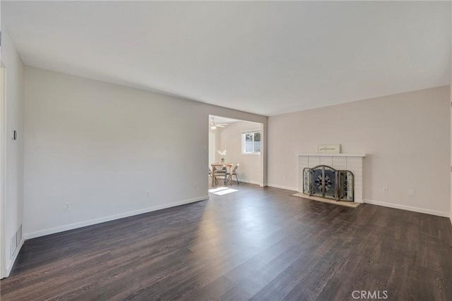 228 W Old Ml, Corona, CA 92882 - unfurnished living room with dark wood-style floors and a fireplace