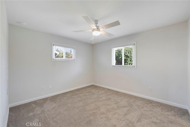 228 W Old Ml, Corona, CA 92882 - empty room featuring plenty of natural light, carpet flooring, and a ceiling fan