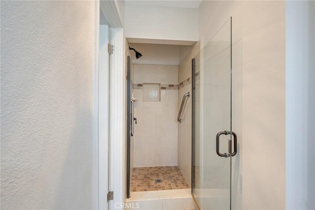 228 W Old Ml, Corona, CA 92882 - bathroom featuring a stall shower and a textured wall