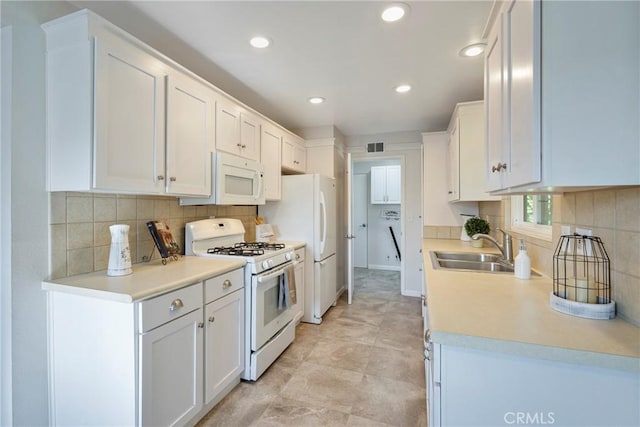 228 W Old Ml, Corona, CA 92882 - kitchen with white appliances, white cabinets, backsplash, light countertops, and recessed lighting