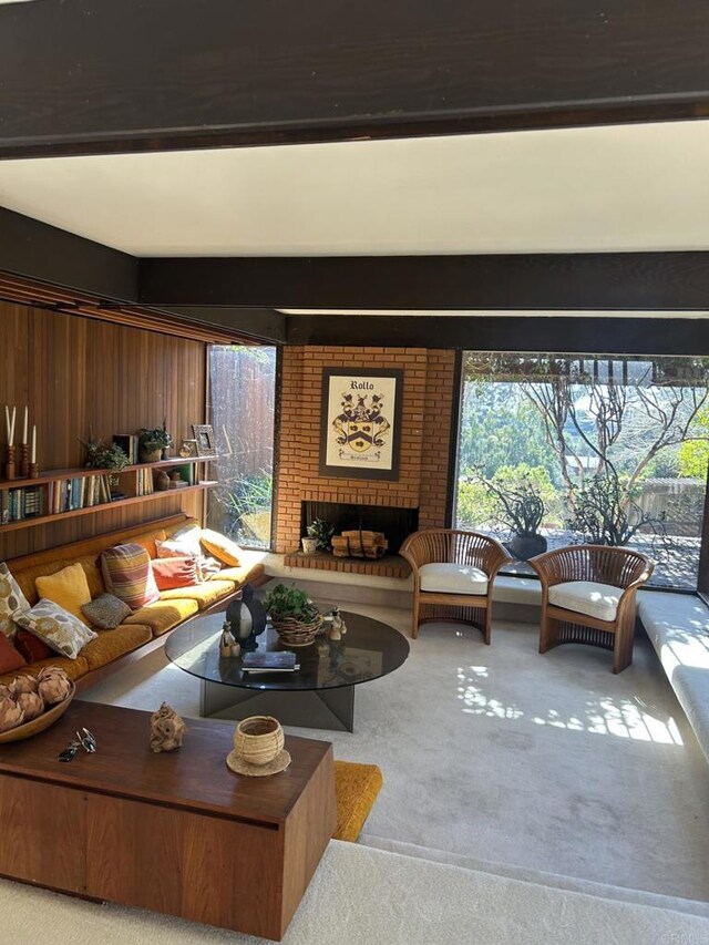 2029 Balboa Ave, Del Mar, CA 92014 - carpeted living room featuring healthy amount of natural light, a brick fireplace, and beamed ceiling