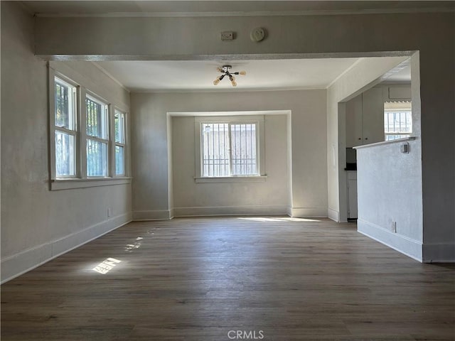 1073 Orizaba Ave, Long Beach, CA 90804 - unfurnished room with wood finished floors, crown molding, baseboards, and a smoke detector