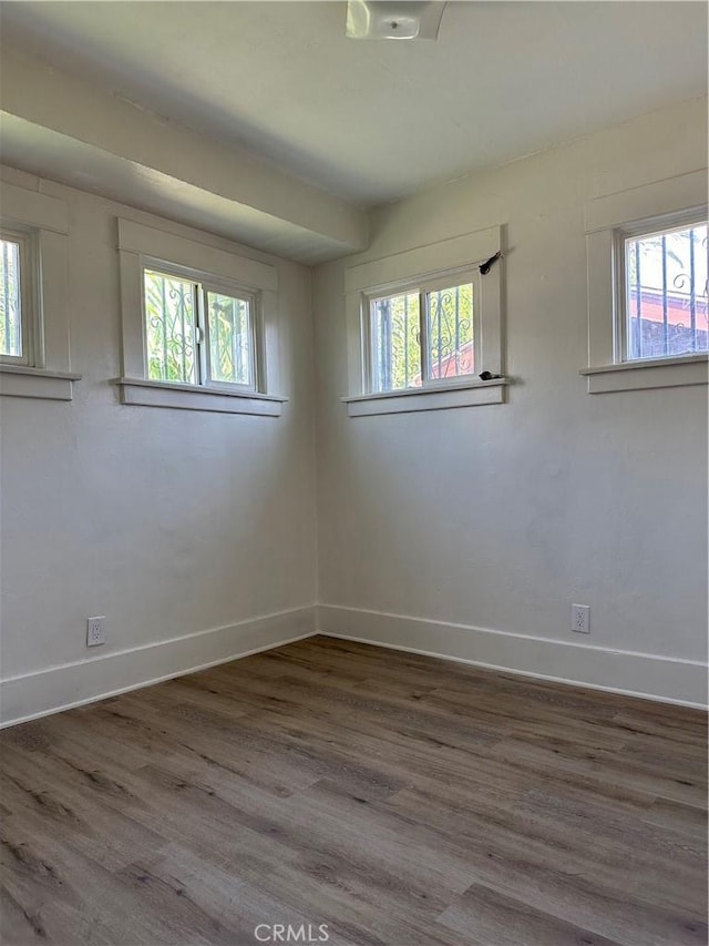 1073 Orizaba Ave, Long Beach, CA 90804 - empty room with baseboards and wood finished floors