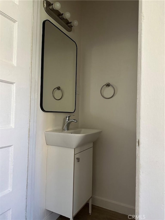 1073 Orizaba Ave, Long Beach, CA 90804 - bathroom featuring baseboards and vanity