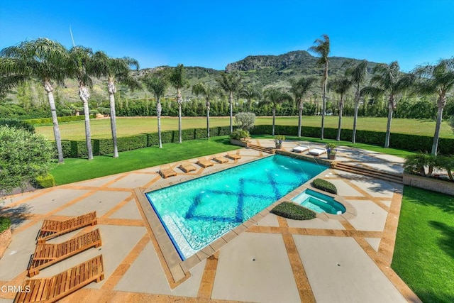 11113 Rocky High Rd, Santa Rosa, CA 93012 - view of swimming pool with a mountain view, a lawn, a patio, and a pool with connected hot tub
