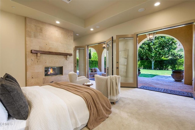11113 Rocky High Rd, Santa Rosa, CA 93012 - bedroom with recessed lighting, carpet flooring, multiple windows, access to outside, and a tiled fireplace