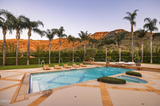 11113 Rocky High Rd, Santa Rosa, CA 93012 - view of swimming pool with a mountain view, a patio, and a pool with connected hot tub