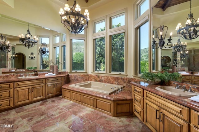 11113 Rocky High Rd, Santa Rosa, CA 93012 - bathroom with a chandelier, two vanities, a whirlpool tub, and a high ceiling