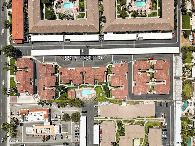 aerial view of property's location with a pool area