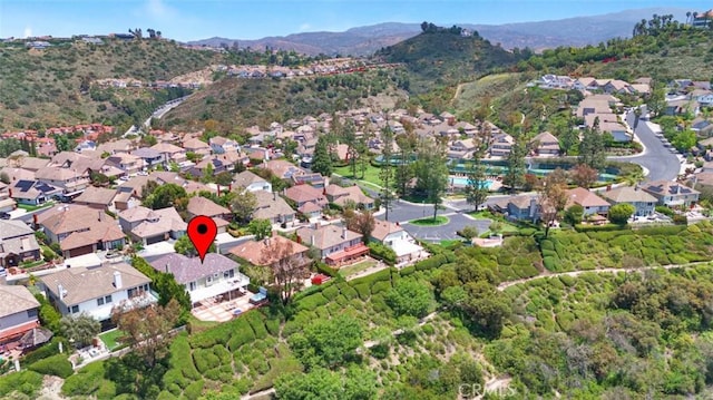 6142 E E W View Dr, Orange, CA 92869 - aerial view of property and surrounding area featuring a mountainous background and nearby suburban area