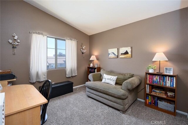 1065 Sycamore Ln, San Jacinto, CA 92582 - living area featuring lofted ceiling, carpet, baseboards, and an office area