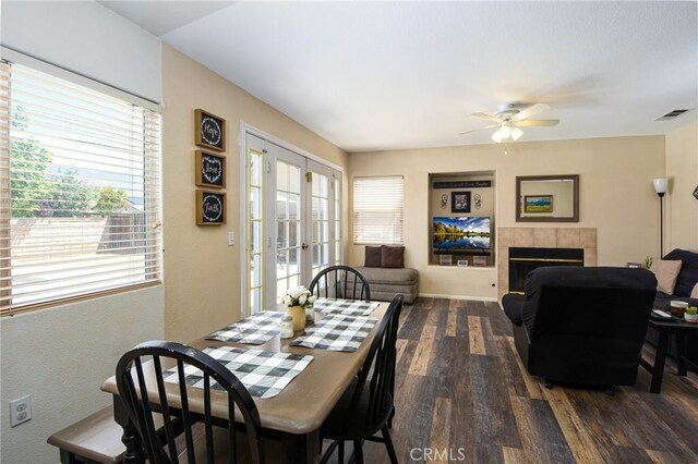 1065 Sycamore Ln, San Jacinto, CA 92582 - dining area with french doors, dark wood-style flooring, a ceiling fan, and plenty of natural light