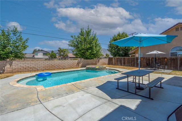 1065 Sycamore Ln, San Jacinto, CA 92582 - view of pool featuring a fenced backyard, a patio, and a pool with connected hot tub