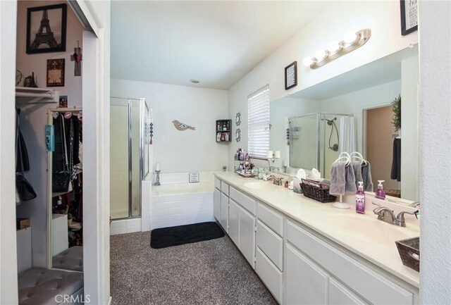 1065 Sycamore Ln, San Jacinto, CA 92582 - full bath featuring a shower stall, a bath, double vanity, and a spacious closet
