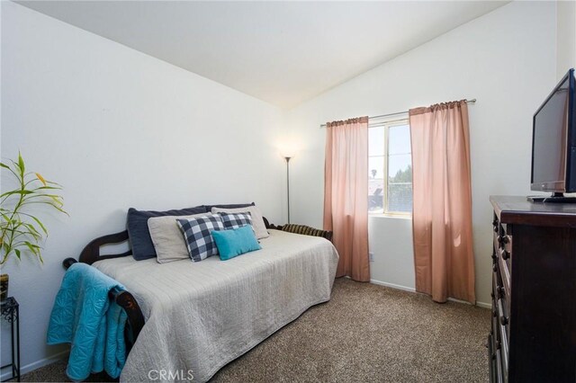 1065 Sycamore Ln, San Jacinto, CA 92582 - carpeted bedroom with lofted ceiling and baseboards