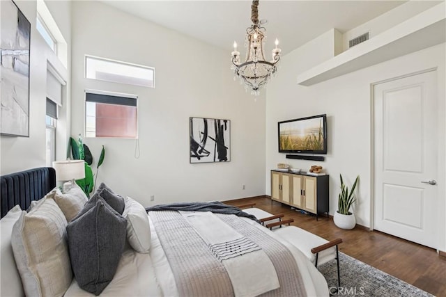 2205 Rockefeller Ln Unit B, Redondo Beach, CA 90278 - bedroom featuring a chandelier, wood finished floors, radiator heating unit, and baseboards