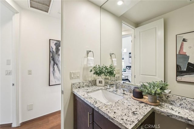 2205 Rockefeller Ln Unit B, Redondo Beach, CA 90278 - bathroom featuring wood finished floors, vanity, and baseboards