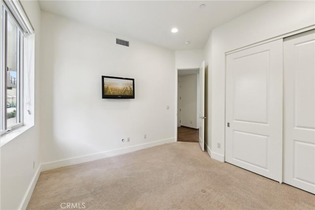 2205 Rockefeller Ln Unit B, Redondo Beach, CA 90278 - unfurnished bedroom featuring multiple windows, light carpet, baseboards, a closet, and recessed lighting