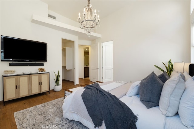 2205 Rockefeller Ln Unit B, Redondo Beach, CA 90278 - bedroom with a chandelier and wood finished floors