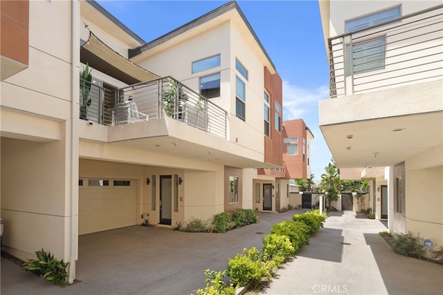 2205 Rockefeller Ln Unit B, Redondo Beach, CA 90278 - view of building exterior featuring an attached garage and concrete driveway