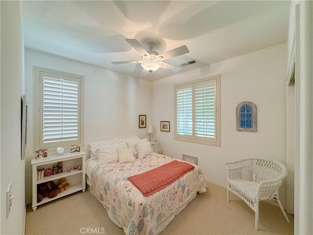 carpeted bedroom featuring ceiling fan
