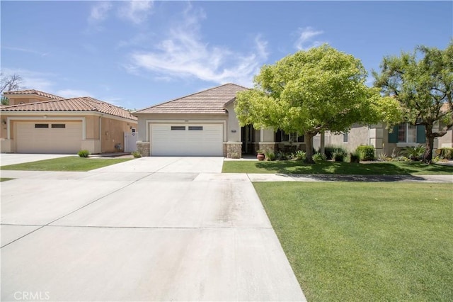 view of front of house featuring stone siding, a front yard, an attached garage, driveway, and stucco siding