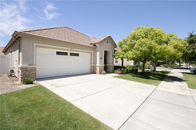 view of front of house with stone siding, a garage, concrete driveway, and stucco siding