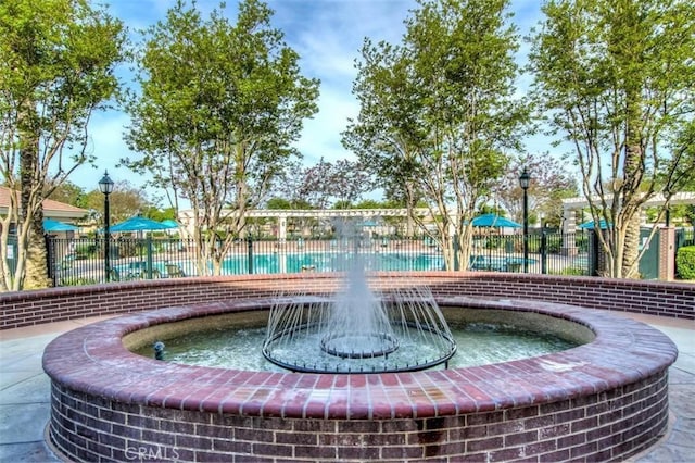 view of property's community with fence