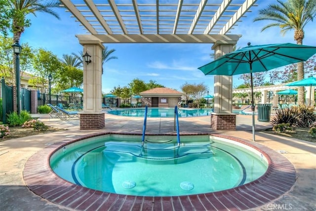 community pool featuring a pergola, a community hot tub, fence, and a patio area