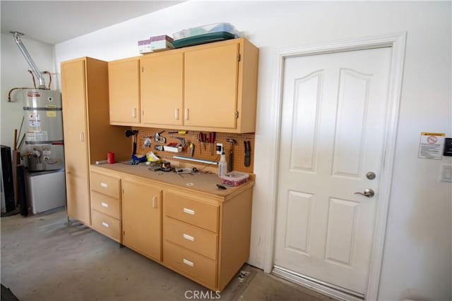 kitchen featuring water heater, decorative backsplash, light countertops, and light brown cabinets