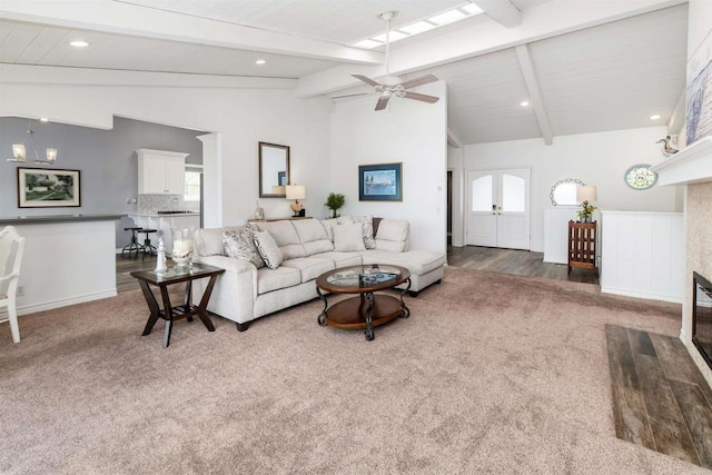 carpeted living area featuring ceiling fan and recessed lighting
