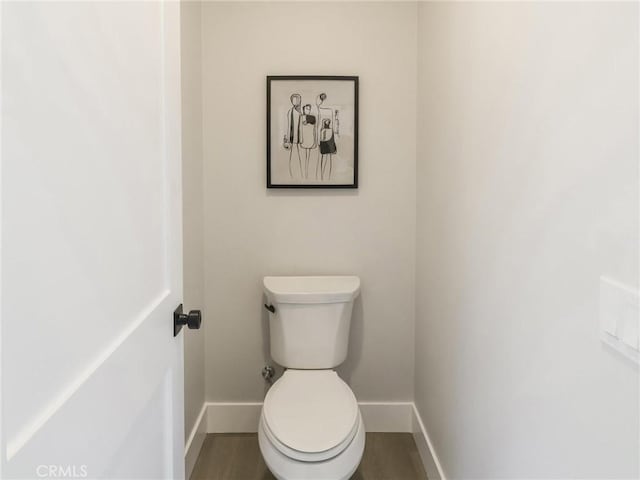 617 E Walnut Ave, Monrovia, CA 91016 - bathroom with baseboards, toilet, and wood finished floors