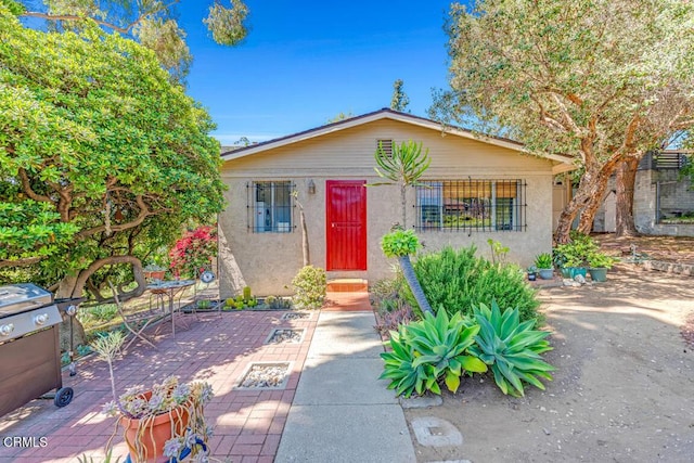 4129 Marmion Way, Los Angeles, CA 90065 - bungalow with a patio area and stucco siding