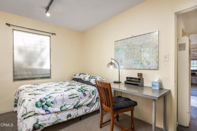 4129 Marmion Way, Los Angeles, CA 90065 - carpeted bedroom with a desk and rail lighting