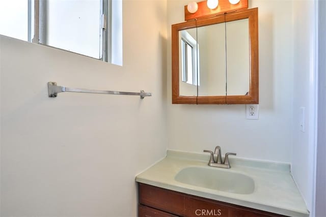bathroom with healthy amount of natural light and vanity