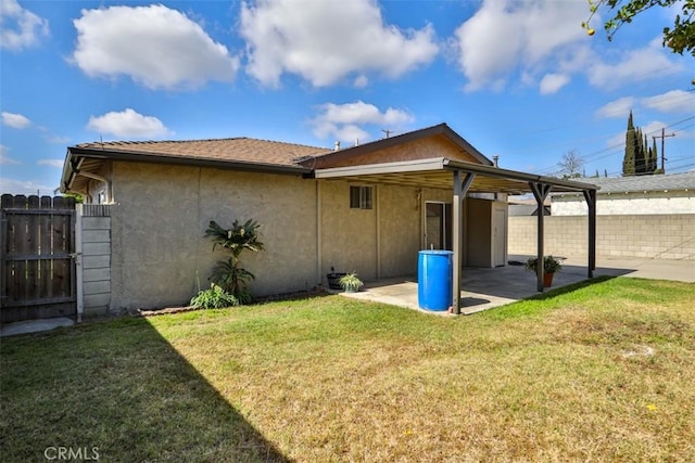 back of house featuring a patio and stucco siding